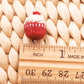 a cupcake sitting on top of a wooden ruler